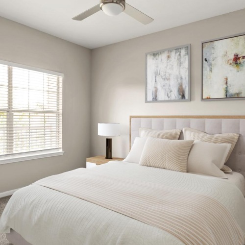 Sleep in style a bedroom with a bed and a fan
