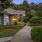 a walkway next to a building with landscaping