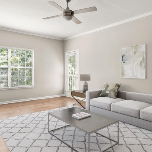 Wide open living areas flooded with natural light a living room with a couch and a table