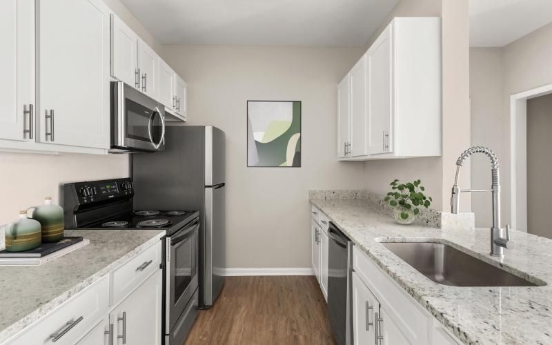 a kitchen with white cabinets